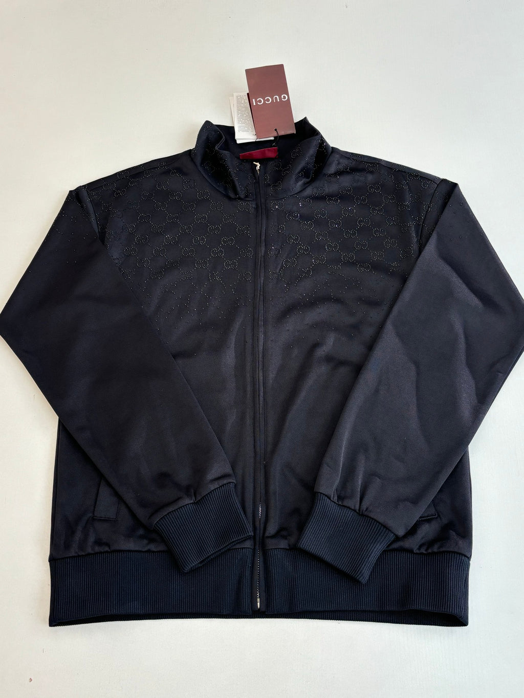 Gucci zip jacket in dark navy with subtle monogram texture and ribbed cuffs