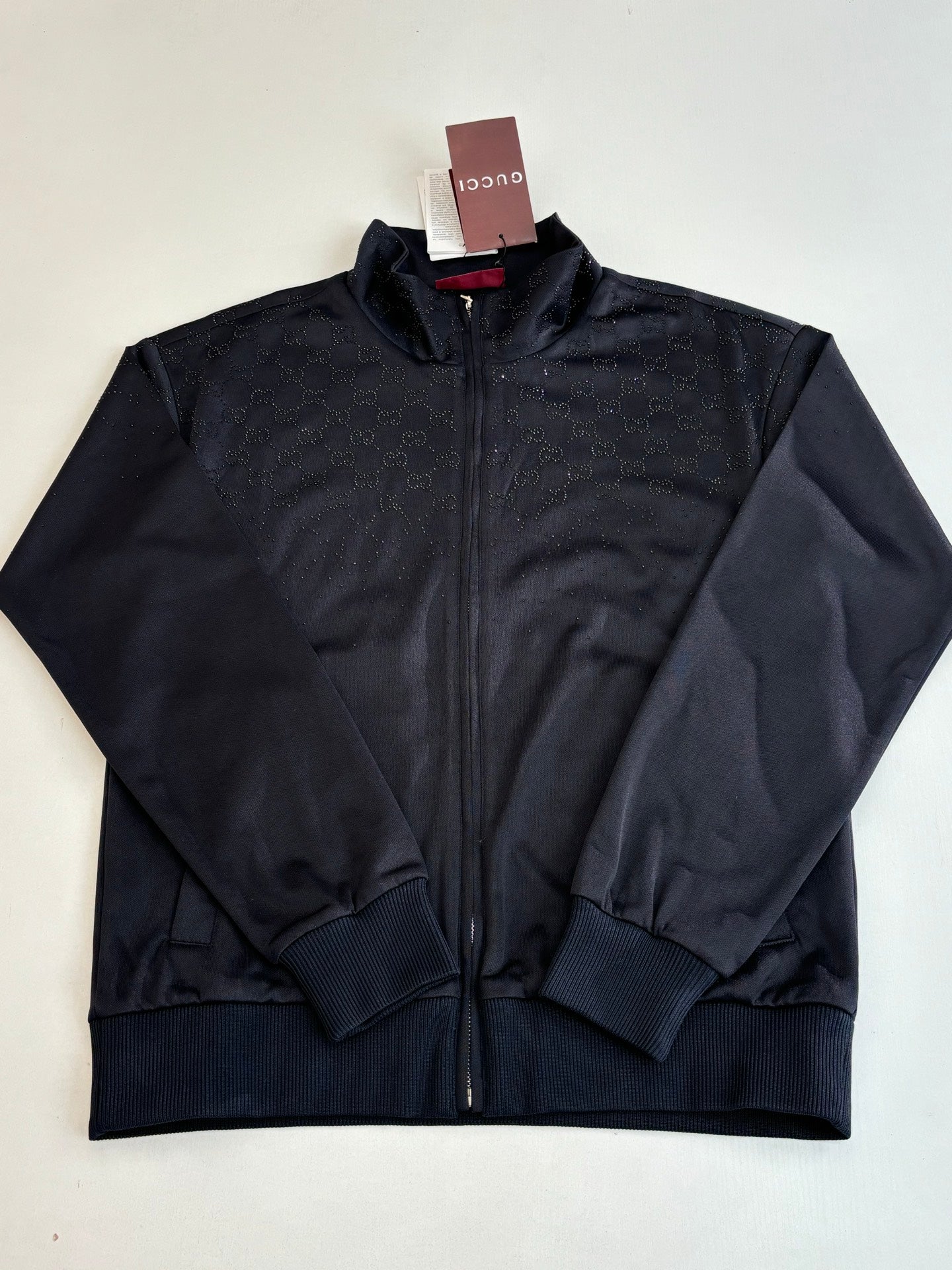 Gucci zip jacket in dark navy with subtle monogram texture and ribbed cuffs