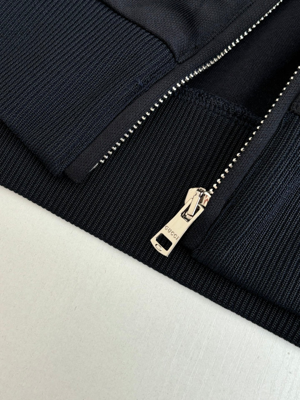 Gucci jacket zipper detail on dark navy ribbed knit cuff