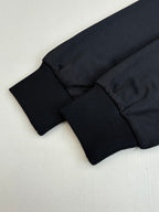 Gucci jacket hem and ribbed cuff cuffs in dark navy, folded close-up