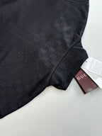 Gucci jacket fabric detail in dark navy with subtle monogram and side panel seam