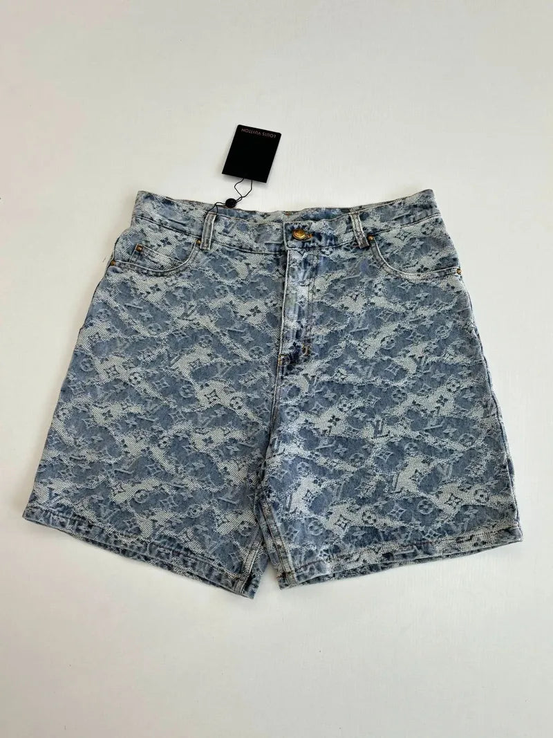 Blue monogram denim shorts on hanger with front zip fly and belt loops