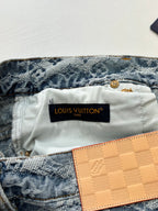 Denim shorts waistband with Louis Vuitton label and tan check leather patch