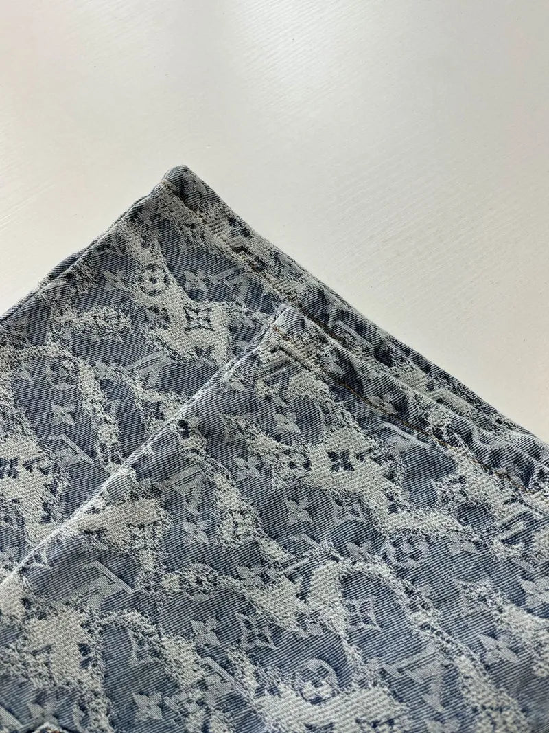 Blue monogram denim shorts close-up of waistband and button