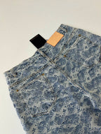 Blue monogram denim shorts with front pockets and removable hang tags