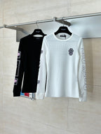 White long-sleeve crewneck shirt on hanger with sleeve and chest logo prints
