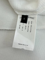White shorts with fabric tag showing size S and Made in USA