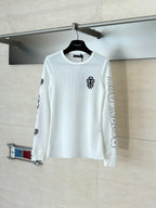 White long-sleeve crewneck shirt with small chest emblem and sleeve prints