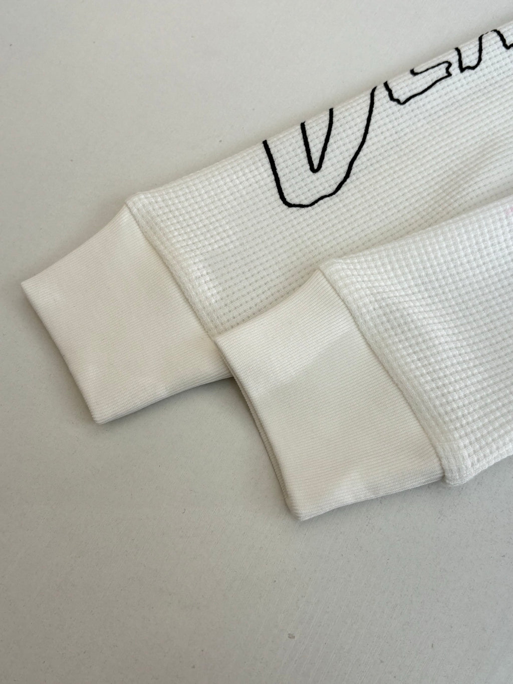 White waffle-knit shorts with elastic waistband