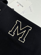 Moncler polo shirt chest logo, dark navy with outlined geometric M emblem