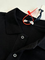 Moncler polo shirt collar detail, dark navy with two metal buttons and branded tag