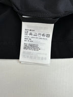 Moncler polo shirt care label and size tag on inner neck, dark navy