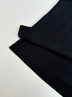 Moncler polo shirt sleeve hem detail in dark navy with neat stitched cuff