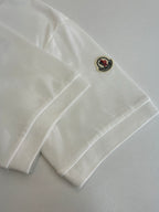 White Moncler polo sleeve patch with small Moncler logo