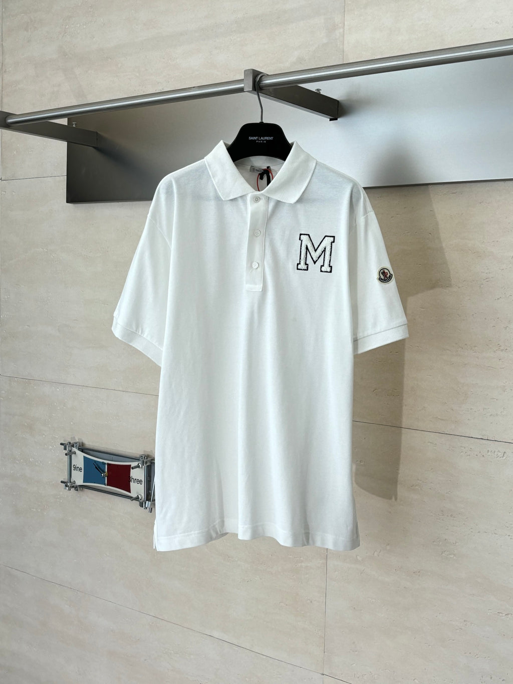 White Moncler short-sleeve polo shirt with M crest and button placket