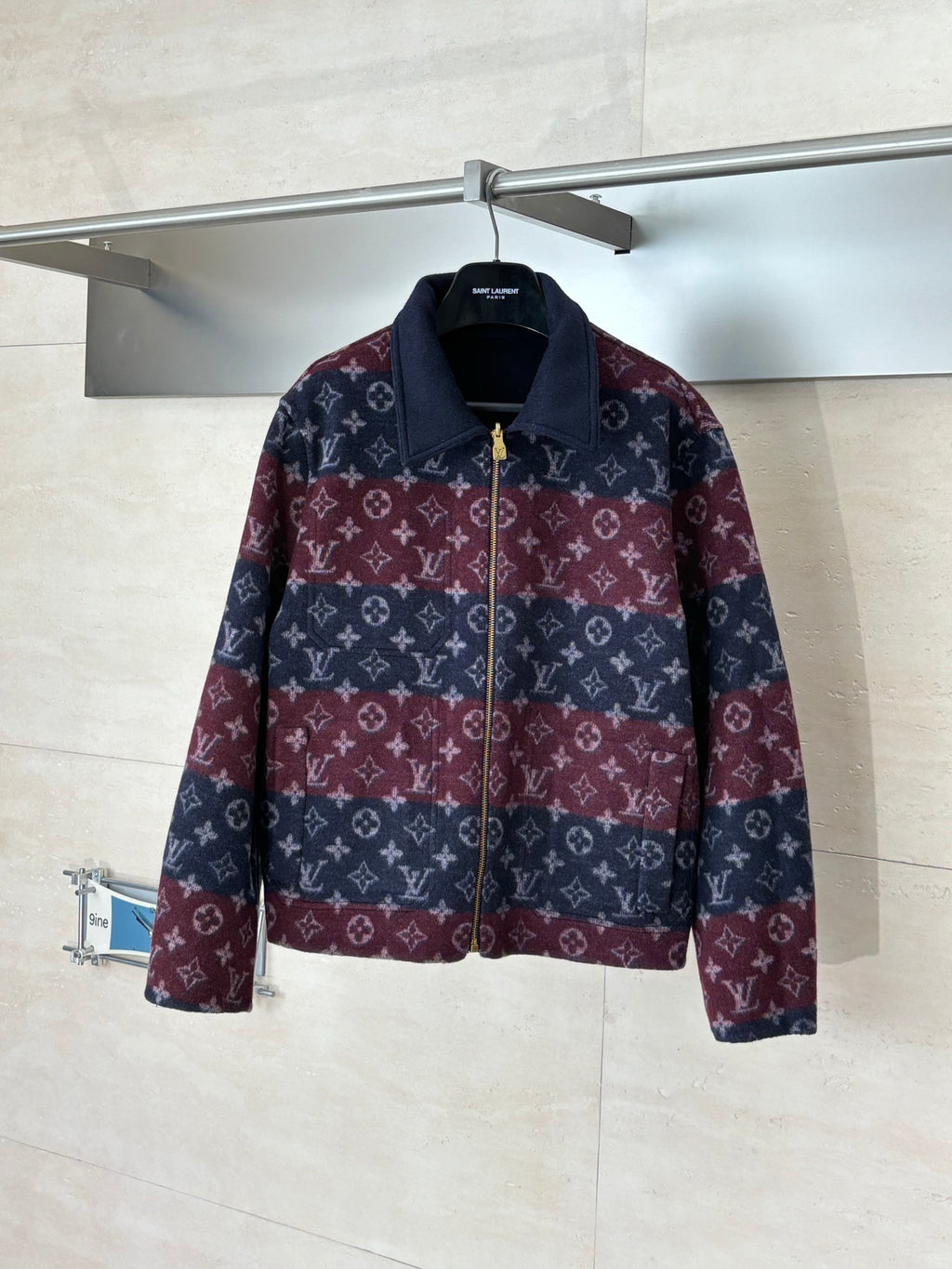 Long Louis Vuitton zip-up jacket with maroon and navy monogram pattern, stand collar.