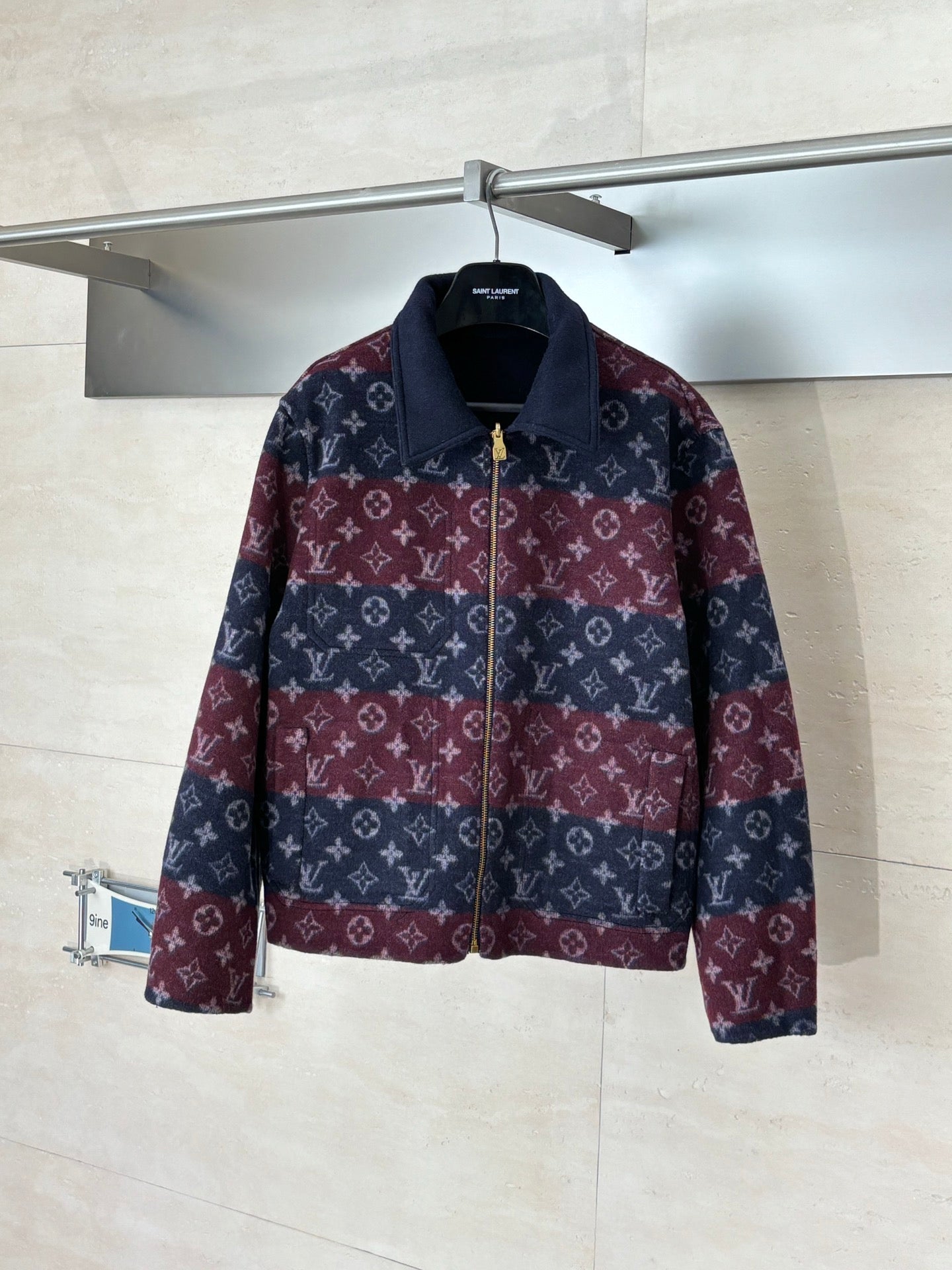 Long Louis Vuitton zip-up jacket with maroon and navy monogram pattern, stand collar.