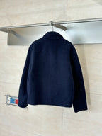 Long Louis Vuitton jacket in dark navy, back view with stand collar and full-zip.