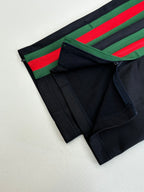 Navy shorts with green and red side stripe tape and front pocket seam