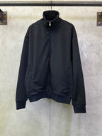 Dark Gucci zip-up jacket with stand collar, front pockets, long sleeves