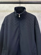 Dark Gucci zip-up jacket with monogram pattern, stand collar and silver zipper