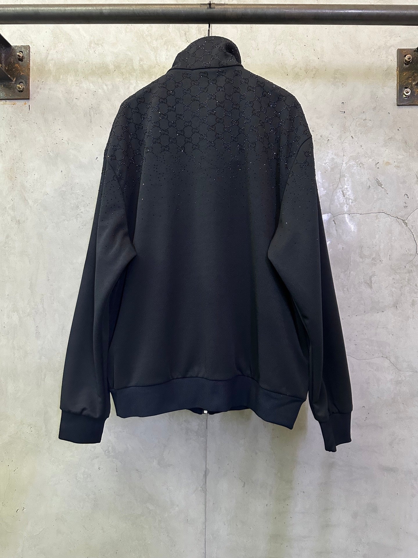 Dark Gucci zip-up jacket back view with stand collar and long sleeves