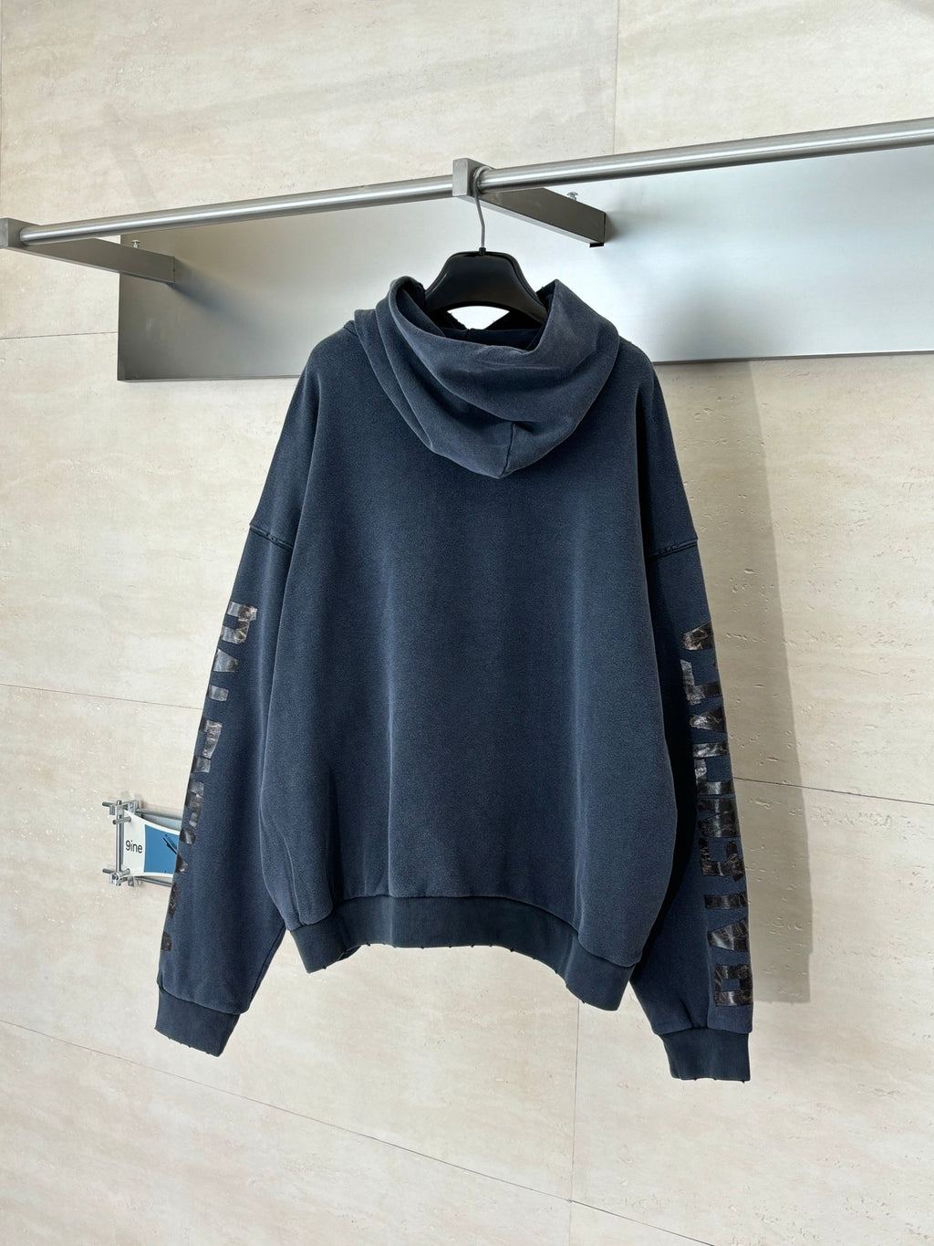 Navy Balenciaga pullover hoodie with hood and embroidered sleeve graphics