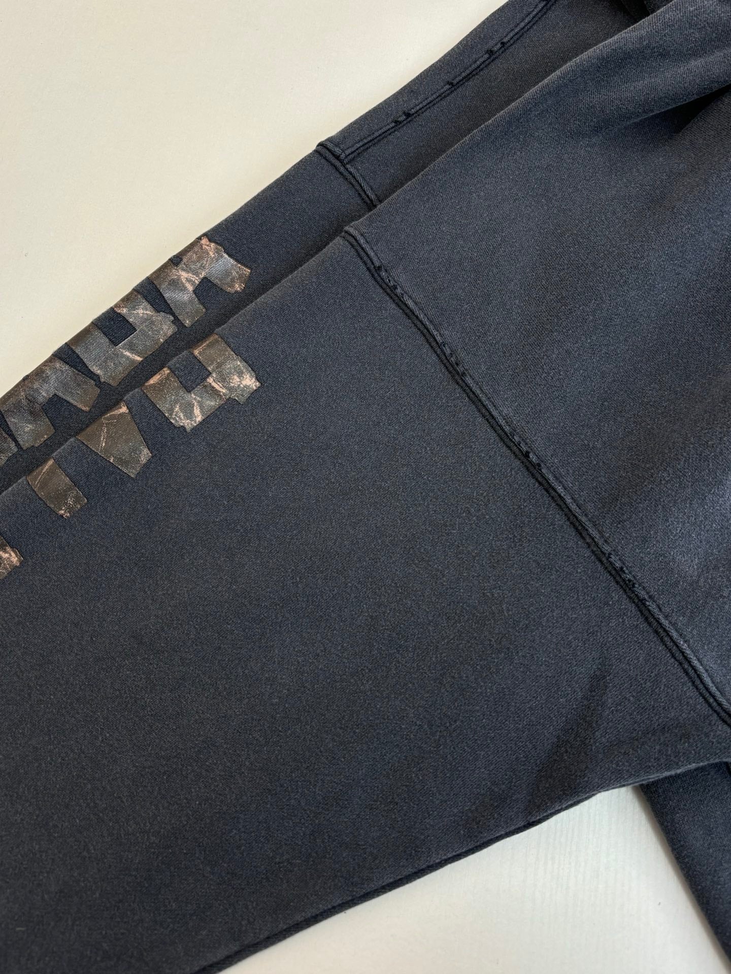Navy Balenciaga joggers with embroidered side pattern and front seam