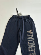 Balenciaga dark navy sweatpants with elastic waistband and vertical logo print
