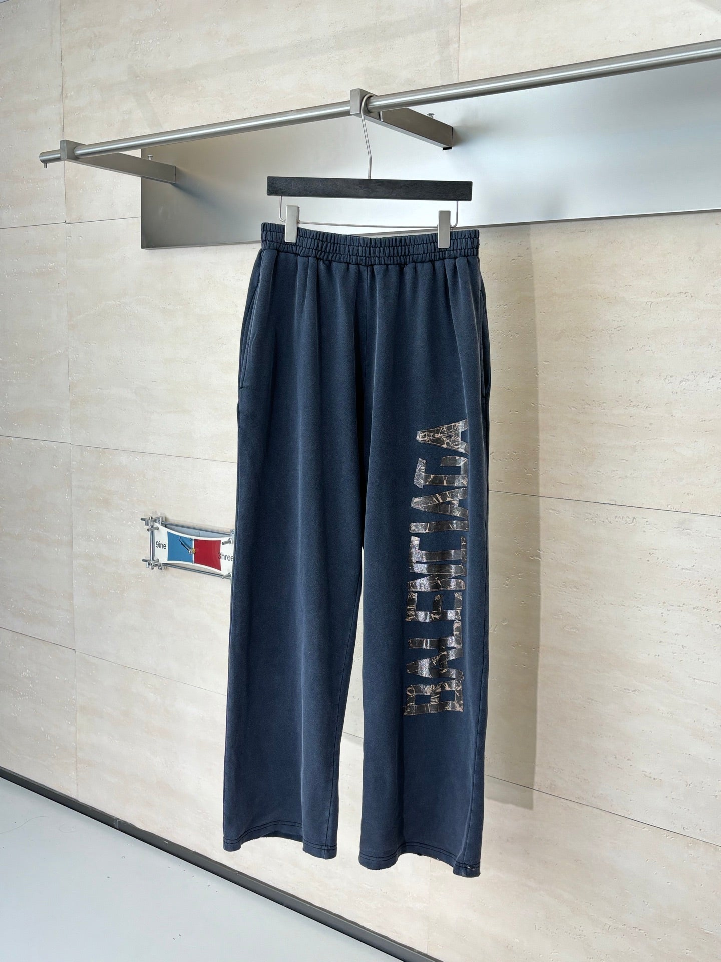 Balenciaga dark navy sweatpants with elastic waistband and side logo print