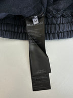 Balenciaga dark navy sweatpants with elastic waistband and Balenciaga care label