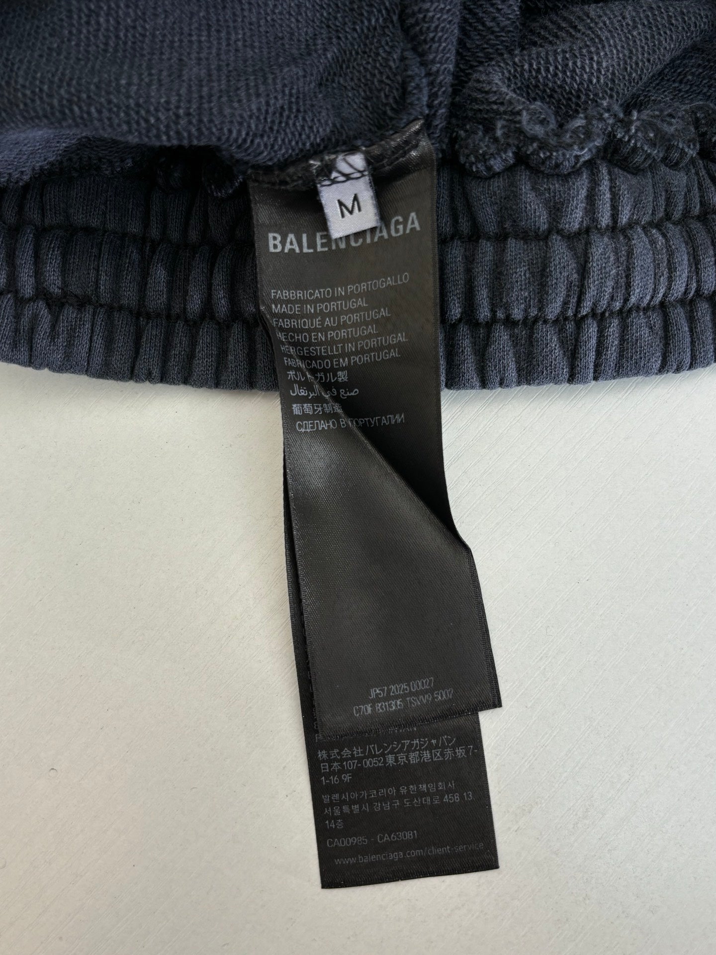 Balenciaga dark navy sweatpants with elastic waistband and Balenciaga care label