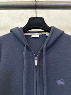 Men's Burberry navy hoodie close-up: front zipper, hood drawcords, small chest logo