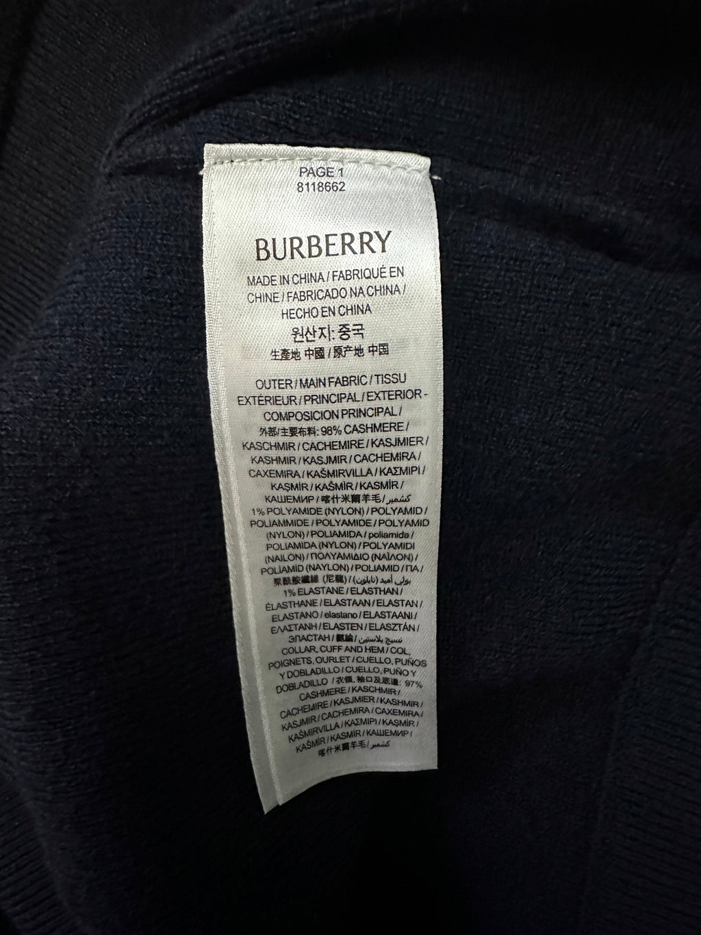 Burberry hoodie care label stitched inside neck area with fabric composition text