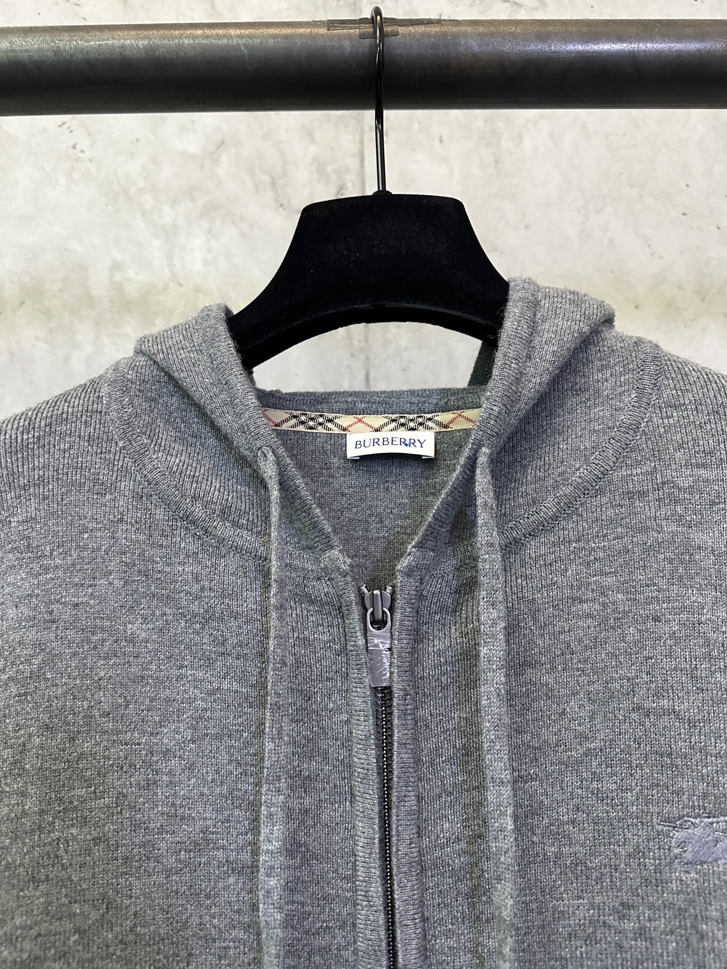 Burberry long zip hoodie in heather gray, close-up of hood and zipper pull