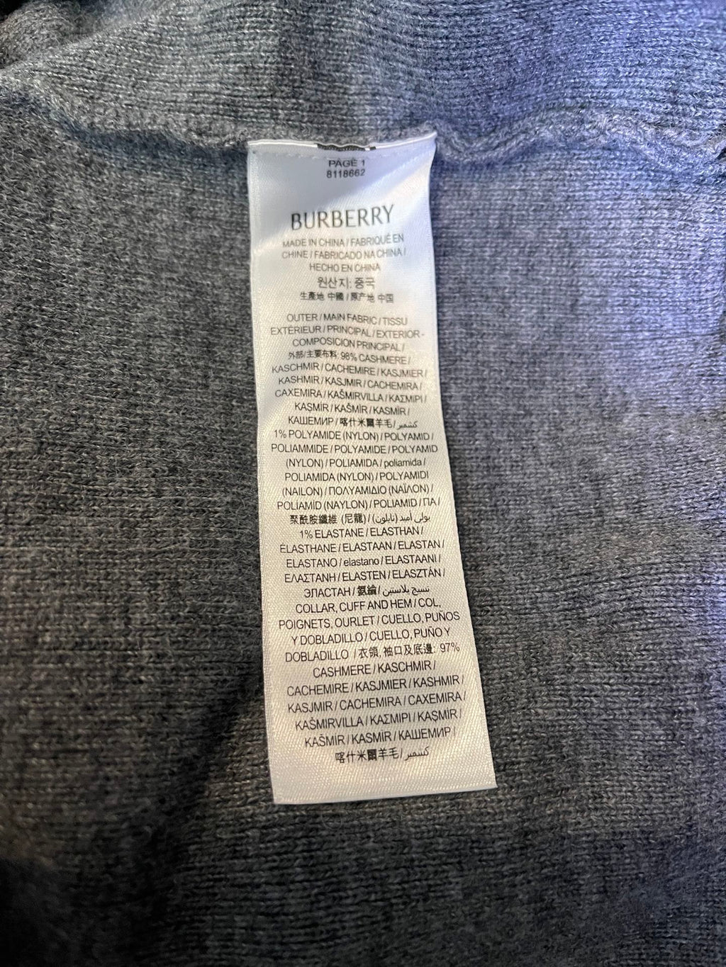 Inside neck label on Burberry long zip hoodie with fabric care text