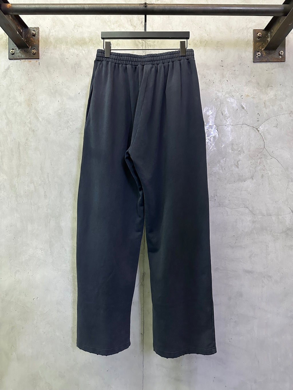 Dark blue wide-leg pants with elastic waistband and simple front styling