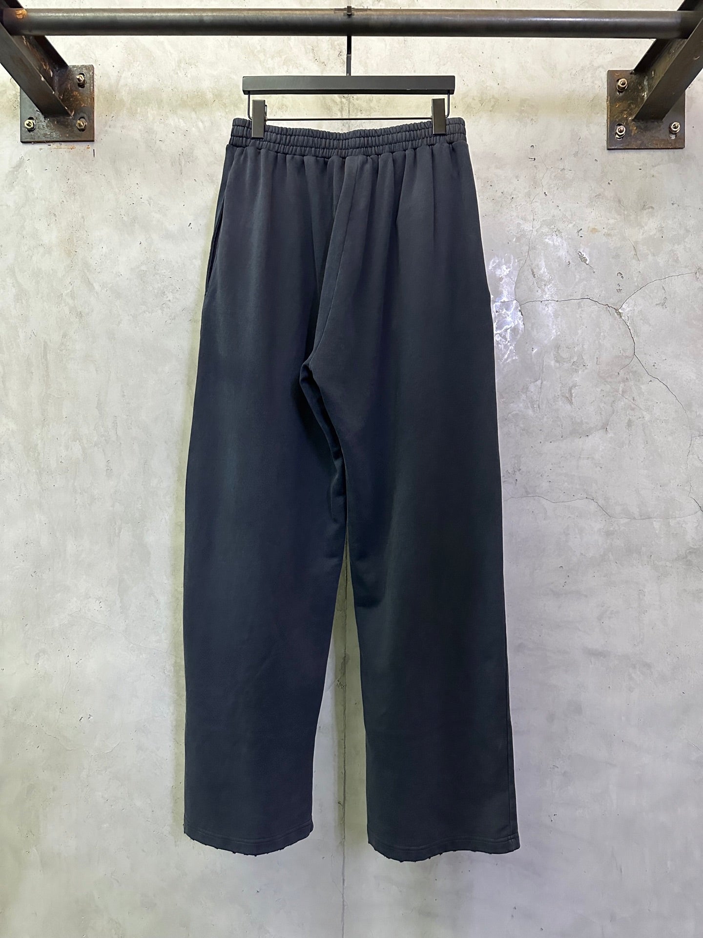 Dark blue wide-leg pants with elastic waistband and simple front styling
