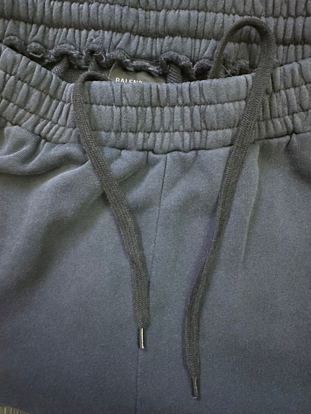 Dark blue drawstring waistband pants with adjustable cord and elastic waist