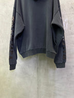Balenciaga long-sleeve hoodie, dark gray, cropped back view with ribbed cuffs and hem