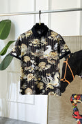 Black button-up shirt with gold, shell, and animal graphic print, short sleeves