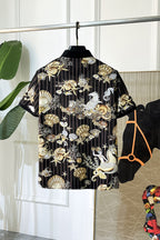Black button-up shirt back view with gold and white shell and animal graphic print