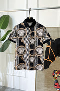Versace shirt with black base, checker pattern, gold chain trim, and Medusa medallions