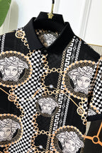 Versace printed shirt neckline with black collar and gold-chain detailing around medallions