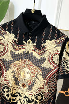 Versace polo shirt close-up of gold lion face print on black fabric