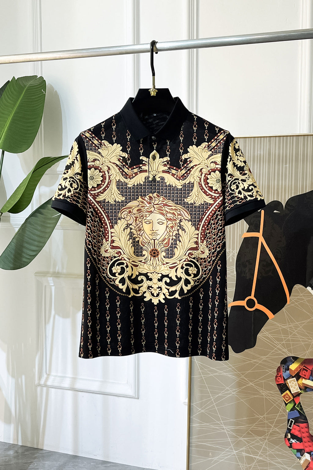 Black Versace polo shirt with ornate baroque lion graphic