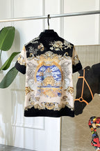 Versace short-sleeve polo shirt with full front baroque-style gold, blue, white artwork