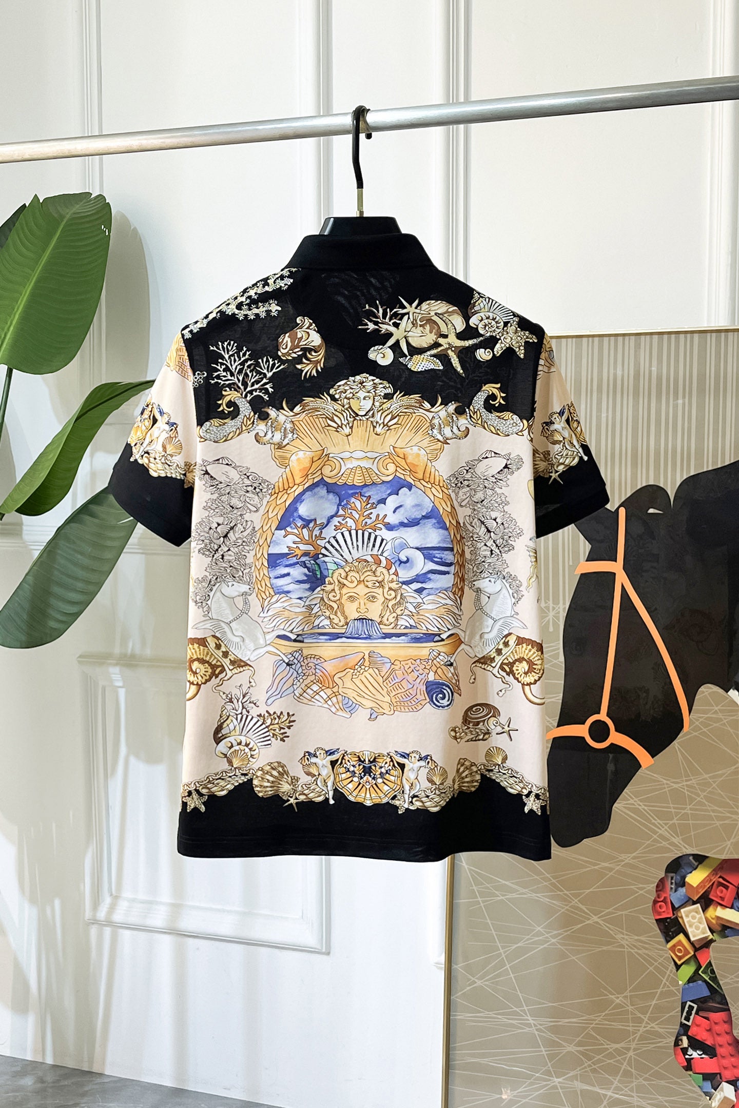 Versace short-sleeve polo shirt with full front baroque-style gold, blue, white artwork