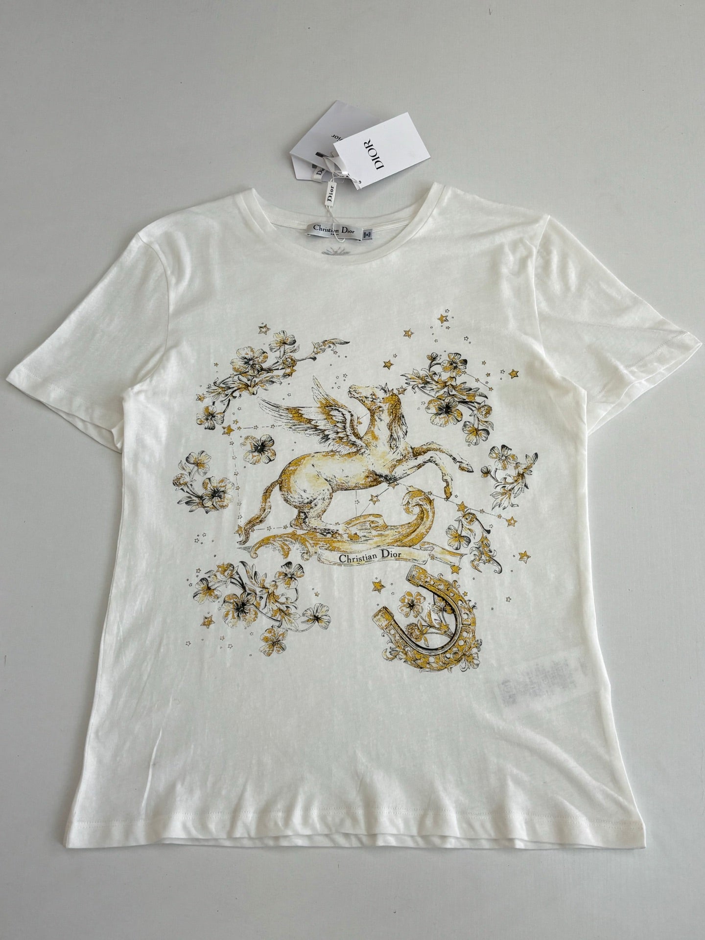 Dior short-sleeve T-shirt, white with large gold horse-and-flower print across chest