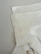 Dior short-sleeve T-shirt back, white fabric with small lower-right gold floral print